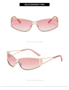 Détail de lunettes de soleil dorées avec verres dégradés roses et branches ajourées