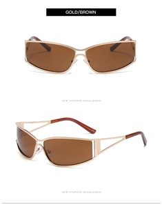 Détail de lunettes de soleil vintage à monture fine avec branches dorées ajourées
