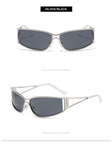 Détail de lunettes de soleil en métal argenté avec branches creuses et verres foncés