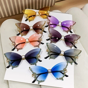 Oversized butterfly wing sunglasses with colorful rhinestones in multiple gradient colors