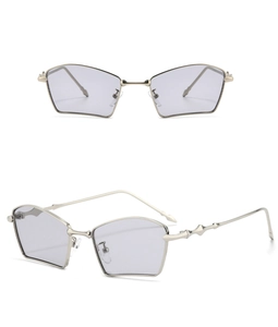 Detail of polygonal metal sunglasses featuring bamboo-style temples and gradient lenses