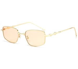 Detail view of gold metal sunglasses with bamboo texture temples and amber lenses