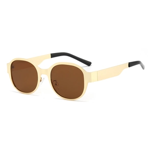 Chic oval oversized sunglasses with golden metal frame and brown lenses for women