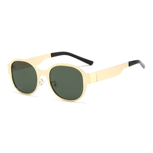 Vintage round metal sunglasses with light gold frames and dark green lenses in a side view