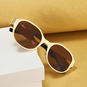 Retro oversized oval metal sunglasses with brown lenses on creative geometric props
