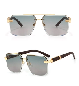 Detail of square rimless sunglasses with gradient lenses, gold bridge and wood temples