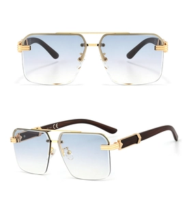 Detail view of square metal frames with wood texture temples and blue gradient lenses