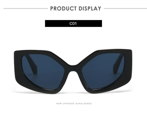 Front view of black polygon sunglasses with thick geometric frames and dark tinted lenses