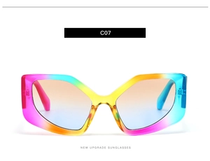 Close-up of geometric polygon sunglasses with rainbow gradient frames and tinted lenses