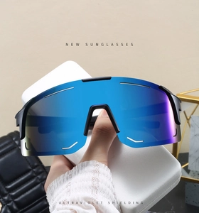 Close-up of sports sunglasses with blue mirrored lenses and black windproof frame