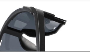Detailed macro view of the hinge structure and matte finish on sports cycling sunglasses