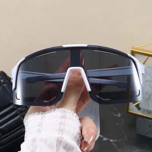 Detail view of white sports sunglasses with grey lenses for cycling and outdoor sports