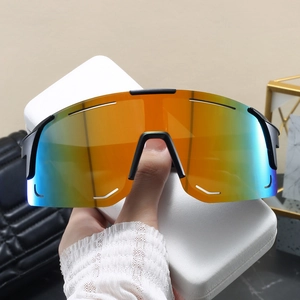 Detail of colorful gradient cycling sunglasses with black frame and white protective case