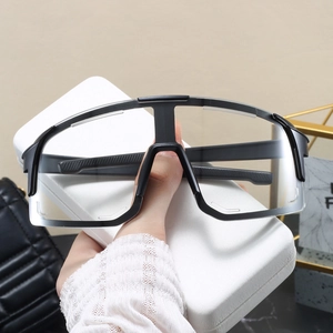 Close-up of stylish black wide-frame cycling glasses with large clear lenses for sports