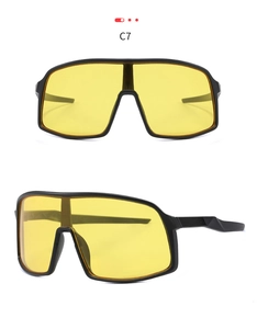 Detail view of matte black sports cycling sunglasses with yellow shield lenses