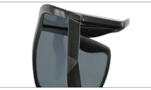 Detail of matte black sports sunglasses showing non-slip texture on the bridge and frame