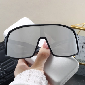 Oversized matte black sports sunglasses with silver mirrored lenses and white case