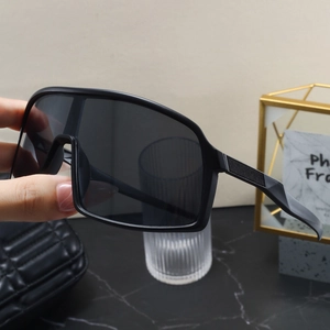 Detailed view of matte black oversized sports sunglasses with non-slip textured temples