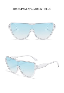 Dettaglio di occhiali da sole oversize senza montatura con lenti blu sfumate