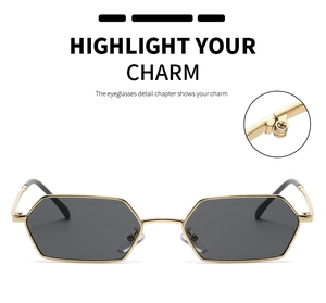 Detail of classic gold metal sunglasses hinge and durable hexagonal frame structure