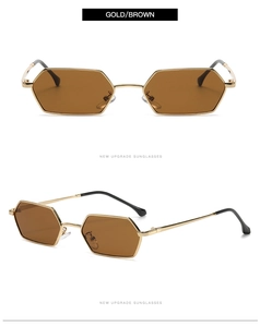 Detail view of hexagonal gold metal frames with brown lenses and black temple tips