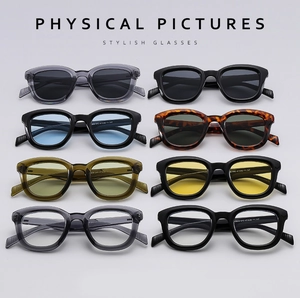 Flat lay of retro round sunglasses in 8 different colors and lens tint variations