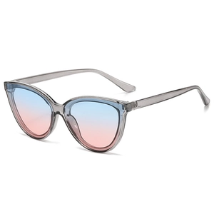Detail of trendy cat-eye sunglasses with gradient lenses and clear grey frame