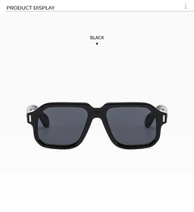 Detailed view of black oversized square sunglasses with silver temple metal accents