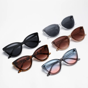 Set of five trendy cat-eye sunglasses in various colors on a clean white background