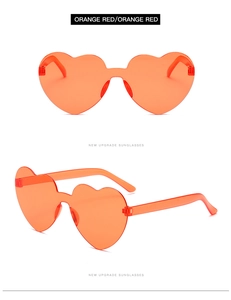 Detail of orange red rimless heart sunglasses with dual perspectives and trendy design