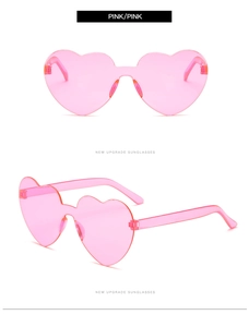 Detail view of pink heart-shaped rimless sunglasses with seamless integrated frame design