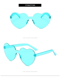 Detail showing cyan heart-shaped rimless sunglasses with high-quality resin lenses
