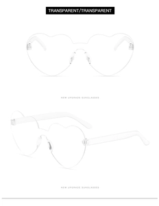 Close-up of transparent heart-shaped rimless sunglasses showing clear frame material