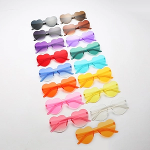 Pack of 16 colorful rimless heart-shaped sunglasses in vibrant candy colors for parties