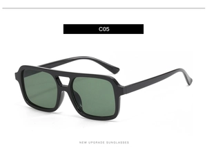 Detail of vintage black square sunglasses with double bridge bar and dark UV lenses