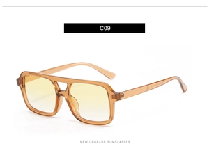 Detail view of double bridge amber sunglasses with yellow gradient lenses and CE mark