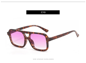 Detail of tortoise shell sunglasses with double bridge and purple gradient lenses