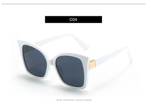 Detailed side view of white square sunglasses with gold metal hinge and dark lenses