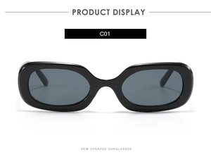 Detailansicht der schmalen ovalen Sonnenbrille mit glänzend schwarzem Rahmen und Gläsern