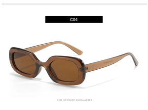 Detail der bernsteinfarbenen ovalen Sonnenbrille mit dicken transparenten Rahmen und C04-Code
