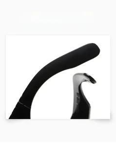 Detail shot of smooth and delicate black sunglasses legs with glossy finish