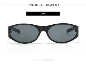 Détail de lunettes de soleil ovales noires classiques avec verres foncés et pont intégré