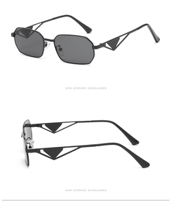 Detail of octagonal metal sunglasses with iconic hollow triangle temple design
