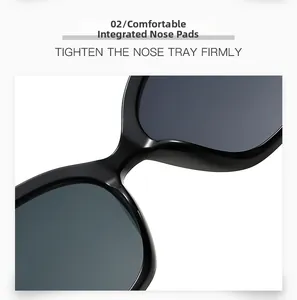 Détail du pont de nez intégré confortable sur ces lunettes de soleil noires surdimensionnées