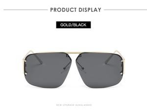Close-up of gold metal frame square sunglasses with black lenses and rivet details