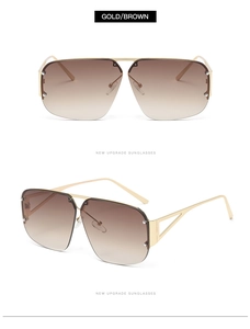 Detail of square gold metal sunglasses with brown gradient lenses and side hollow-out design