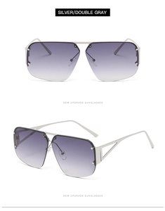 Detail of silver metal frame and double gray gradient lenses on pilot sunglasses