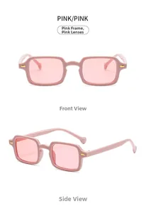 Detail view of pink rectangular sunglasses showing golden metal hinges and translucent lenses