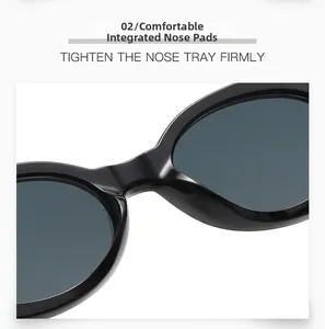 Detail of ergonomic integrated nose pads on black oval sunglasses for comfortable wear