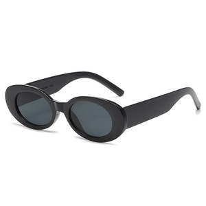 Retro oval black sunglasses with thick frames and dark grey lenses for a vintage look